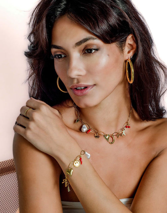 ovale schakelarmband met bedels goudkleurig