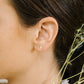 Gold-colored stud bar