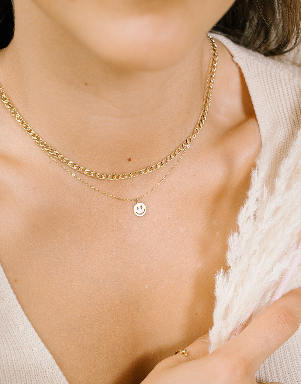 Fijne ketting met smiley hanger goudkleurig