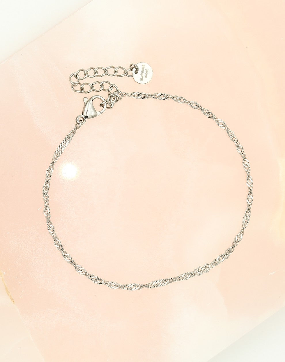 Finely twisted silver-colored bracelet
