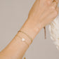 Smiley armband fijn goudkleurig