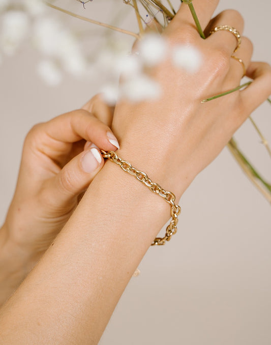 Schakelarmband grof goudkleurig