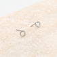 silver-colored open circle earring