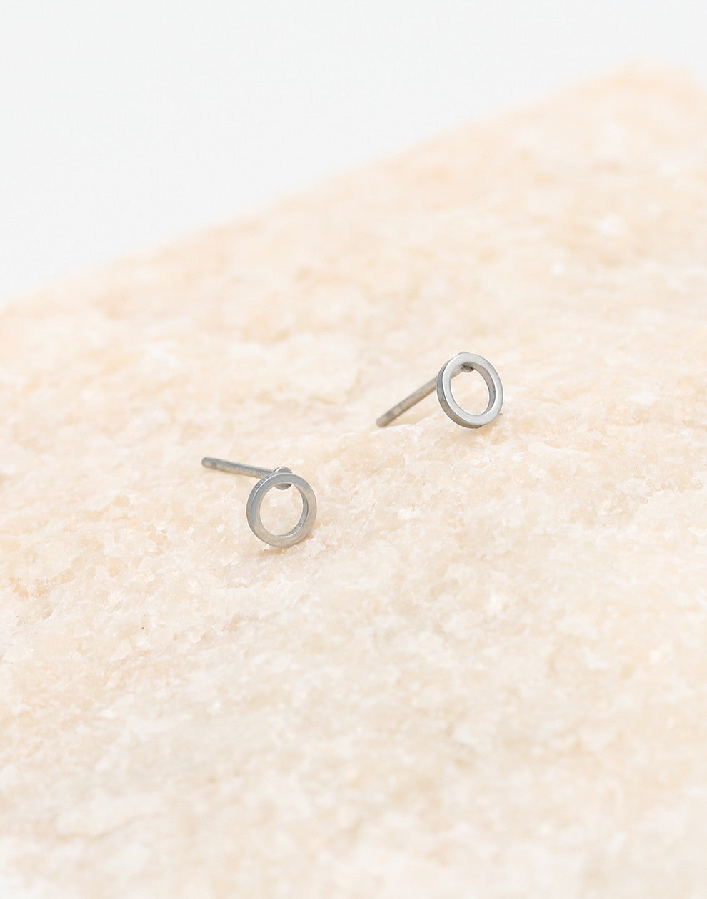 silver-colored open circle earring