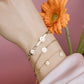 Fijne armband met 5 smiley hangers goudkleurig