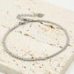 Armband tennis en gedraaide schakel zilverkleurig