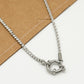 Twisted link necklace with stones and silver-colored clasp