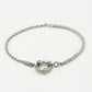 Armband gedraaide schakel met steentjes zilverkleurig