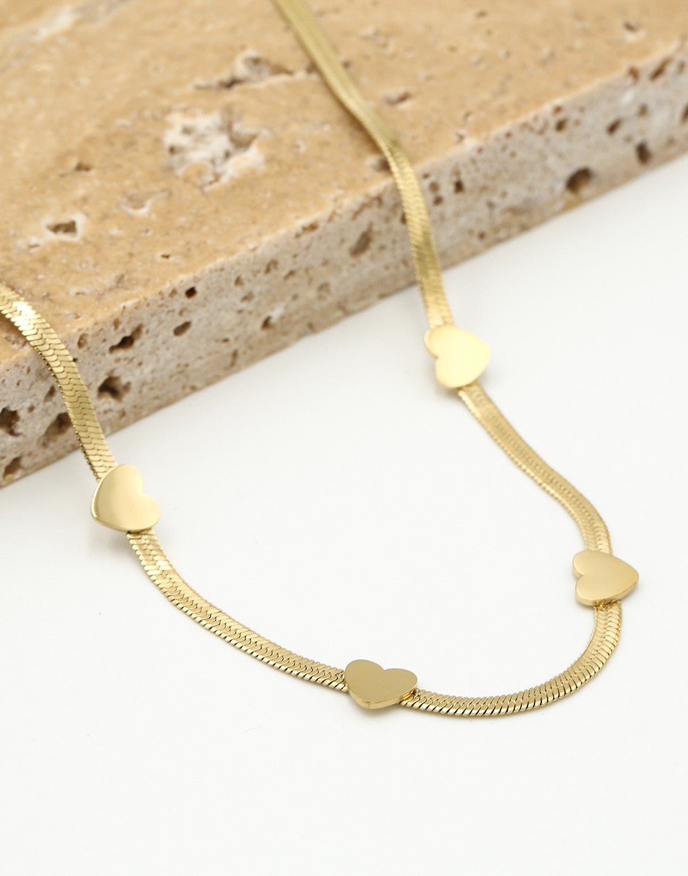 Ketting snake met hartjes goudkleurig