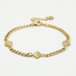 Bracelet with gold-colored clovers