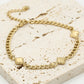 Bracelet with gold-colored clovers