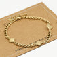 Bracelet with gold-colored clovers