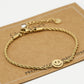 Gedraaide armband smiley goudkleurig