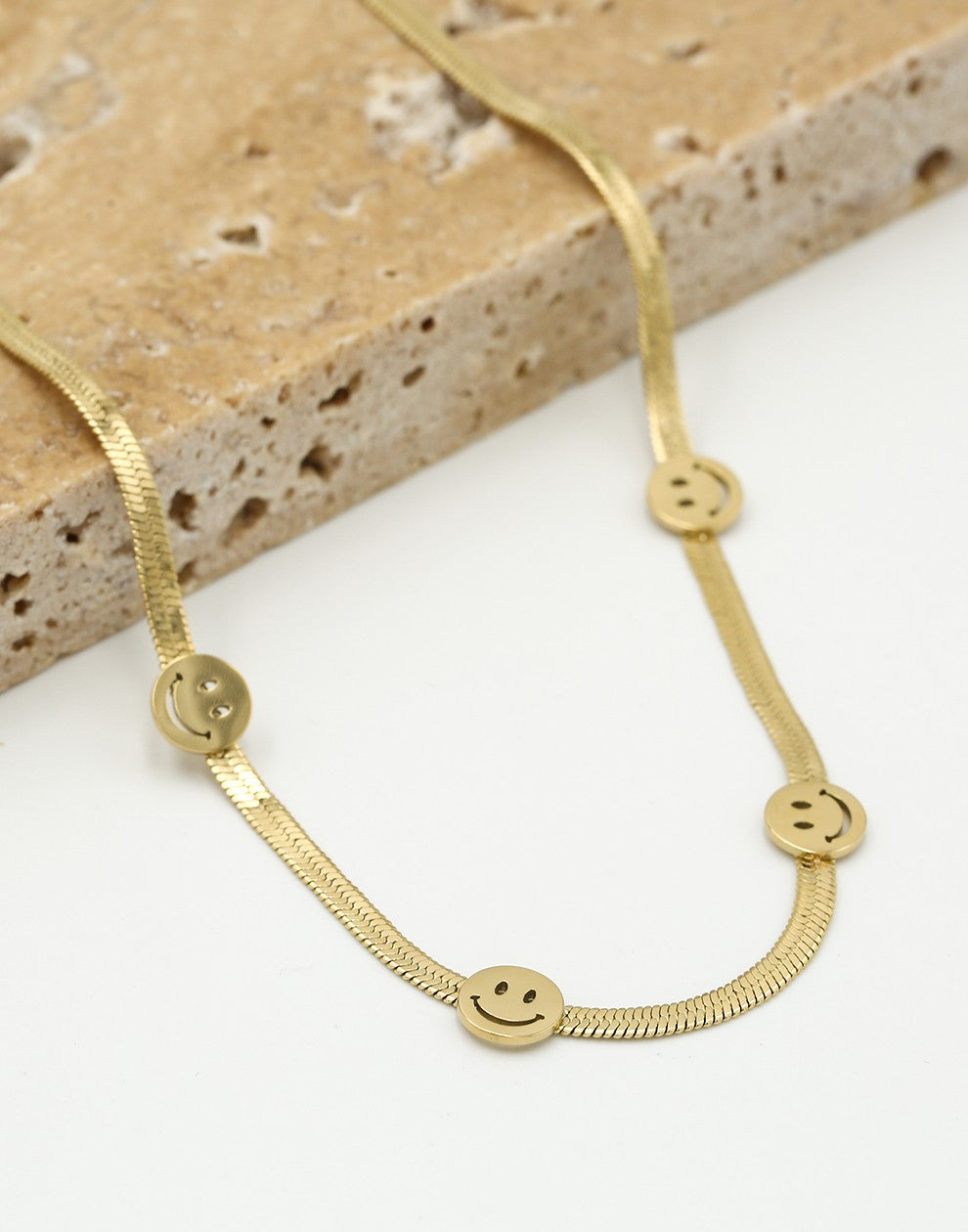 Ketting snake met smileys goudkleurig