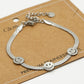 Armband met 3 smileys zilverkleurig