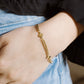 Bracelet with gold-colored clovers