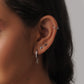 Silver-colored stud bar