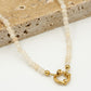 Kralenketting met slotje beige
