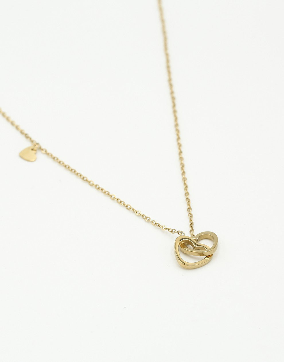 Ketting dubbele hartjes met bedel goudkleurig