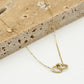 Ketting dubbele hartjes met bedel goudkleurig