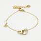 Armband dubbele hartjes met bedel goudkleurig