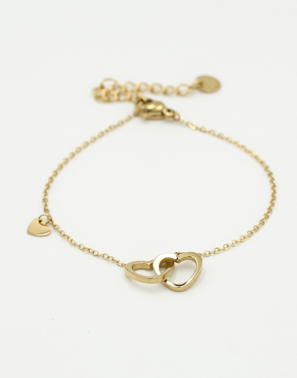 Armband dubbele hartjes met bedel goudkleurig