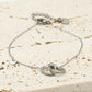 Armband dubbele hartjes met bedel zilverkleurig