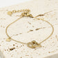 Armband dubbele hartjes met bedel goudkleurig