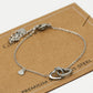 Armband dubbele hartjes met bedel zilverkleurig