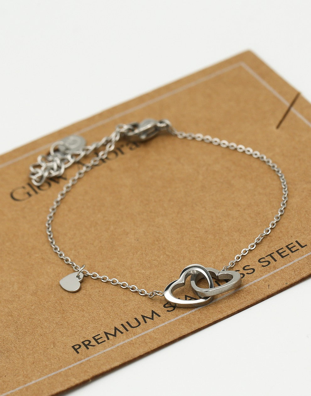 Armband dubbele hartjes met bedel zilverkleurig