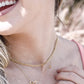 Ketting dubbele hartjes met bedel goudkleurig