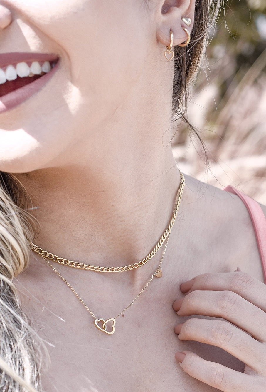 Ketting dubbele hartjes met bedel goudkleurig