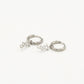Silver-colored star earrings