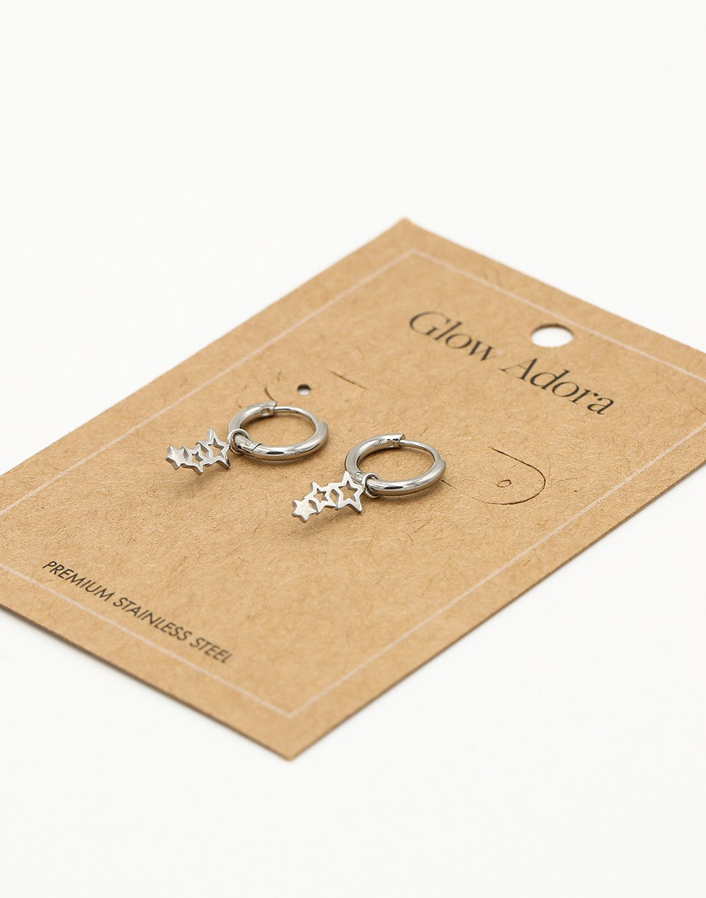 Silver-colored star earrings