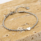 Armband gedraaid met hartje zilverkleurig