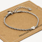 Armband gedraaid met hartje zilverkleurig