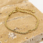 Armband gedraaid met open hartje goudkleurig