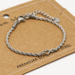 Armband gedraaid met open hartje zilverkleurig