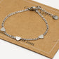 Schakelarmband drie hartjes zilverkleurig