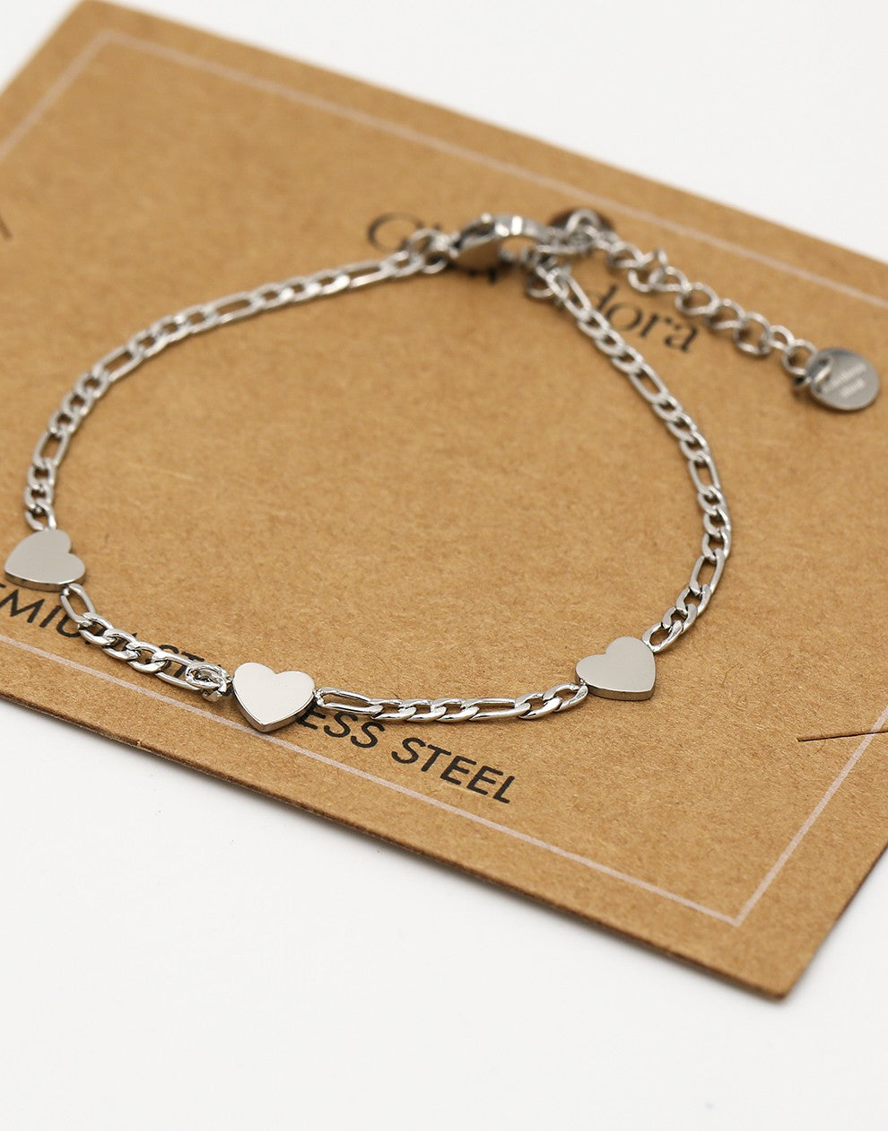 Schakelarmband drie hartjes zilverkleurig