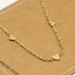 Schakelketting drie hartjes goudkleurig
