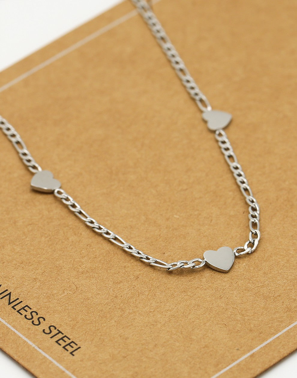 Schakelketting drie hartjes zilverkleurig
