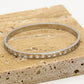 Armband bangle hartjes zilverkleurig