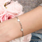 Schakelarmband drie hartjes zilverkleurig