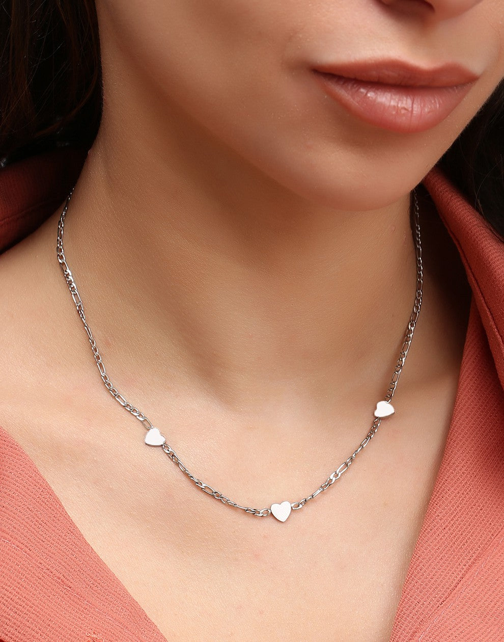 Schakelketting drie hartjes zilverkleurig