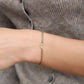 Armband gedraaid met open hartje goudkleurig
