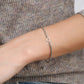 Armband gedraaid met open hartje zilverkleurig