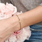 Armband gedraaid met hartje goudkleurig