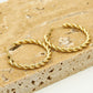 Oorringen gedraaid patroon goudkleurig 30mm