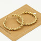 Oorringen gedraaid patroon goudkleurig 30mm